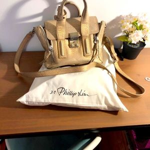 3.1 Philip Lim golden mini Pashli leather satchel .